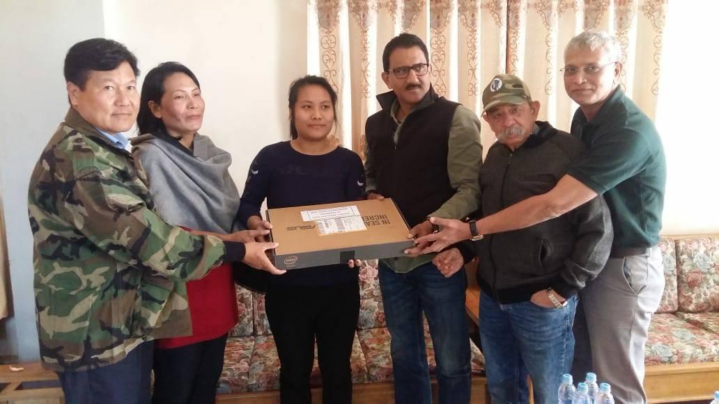 Shri. Sunil Rane visited a Martyr's house in Churachandpur, Imphal and handed a laptop to his daughter Ms. Sangladeih to provide her educational support under an initiative of Atharva Foundation, '100 computers 100 daughters 100 days'